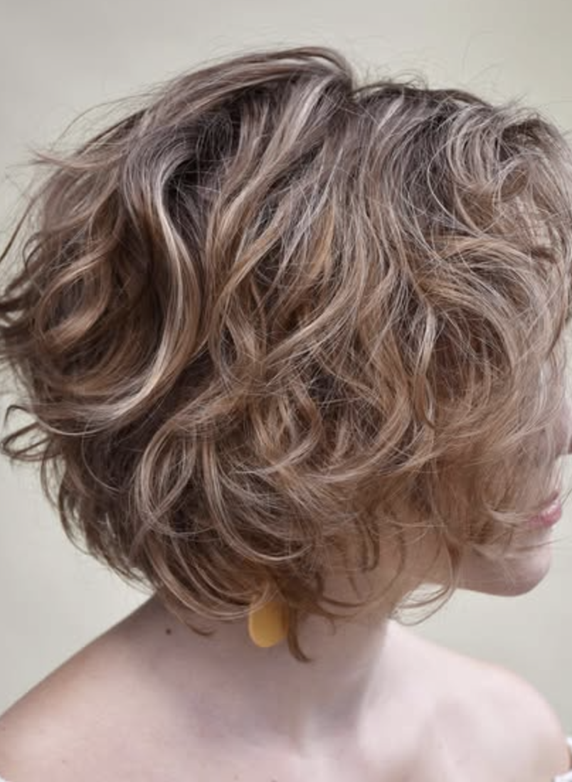 Curly Layered Bob with Dark Roots