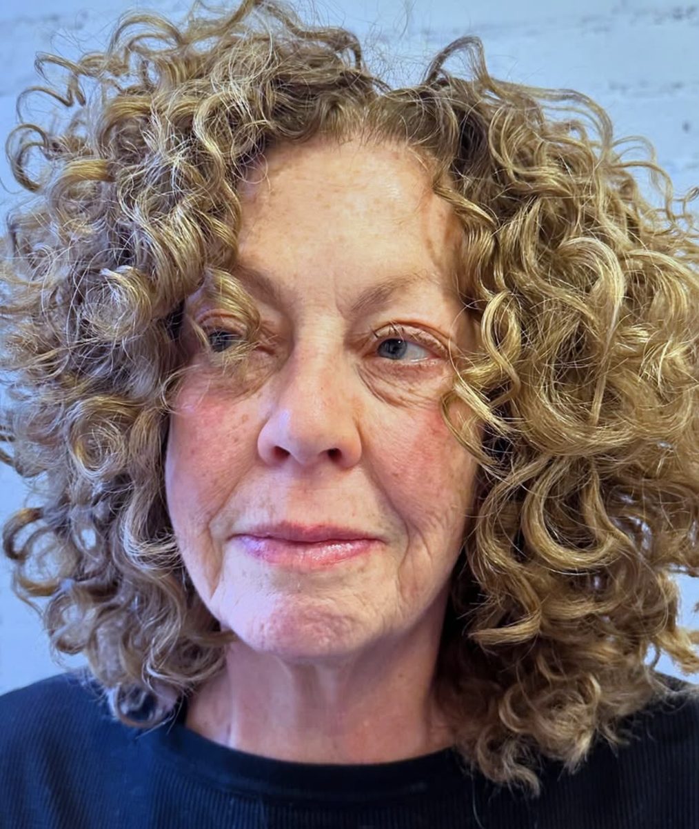 Curly Lob with Side-Swept Bangs