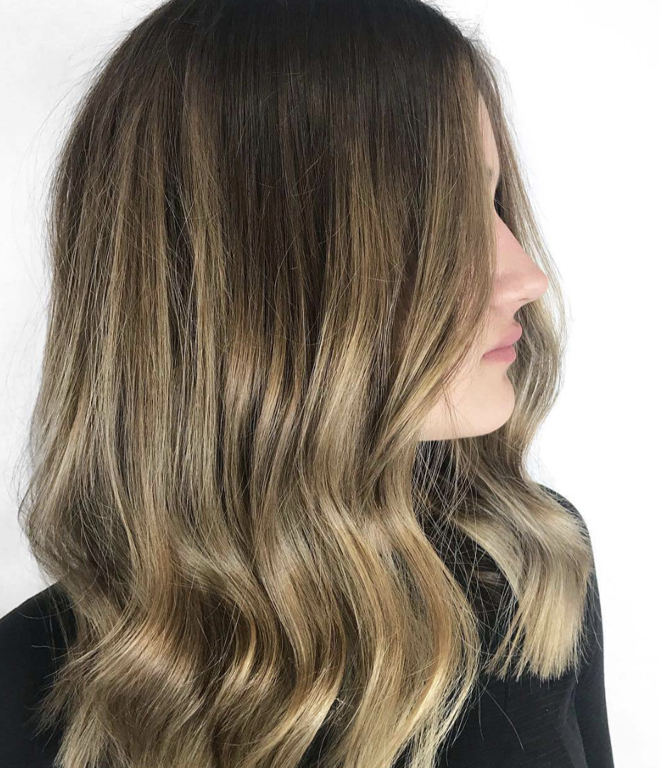 Dark Rooted Blonde with Mid-Length Layers