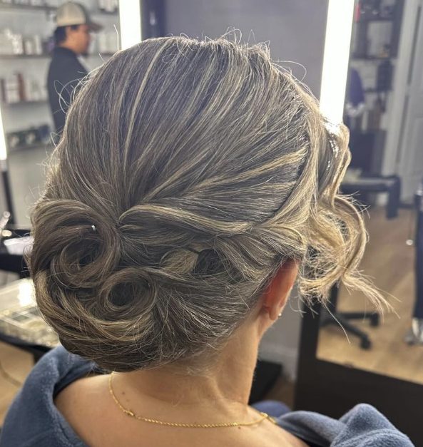Elegant Chignon with Wispy Side Bangs