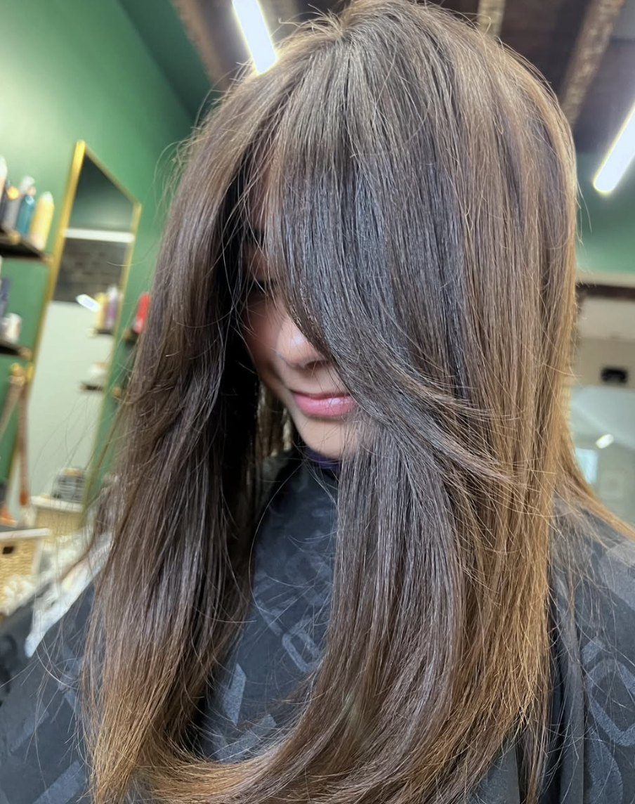 Mid-Length Feathered Cut with Curtain Bangs