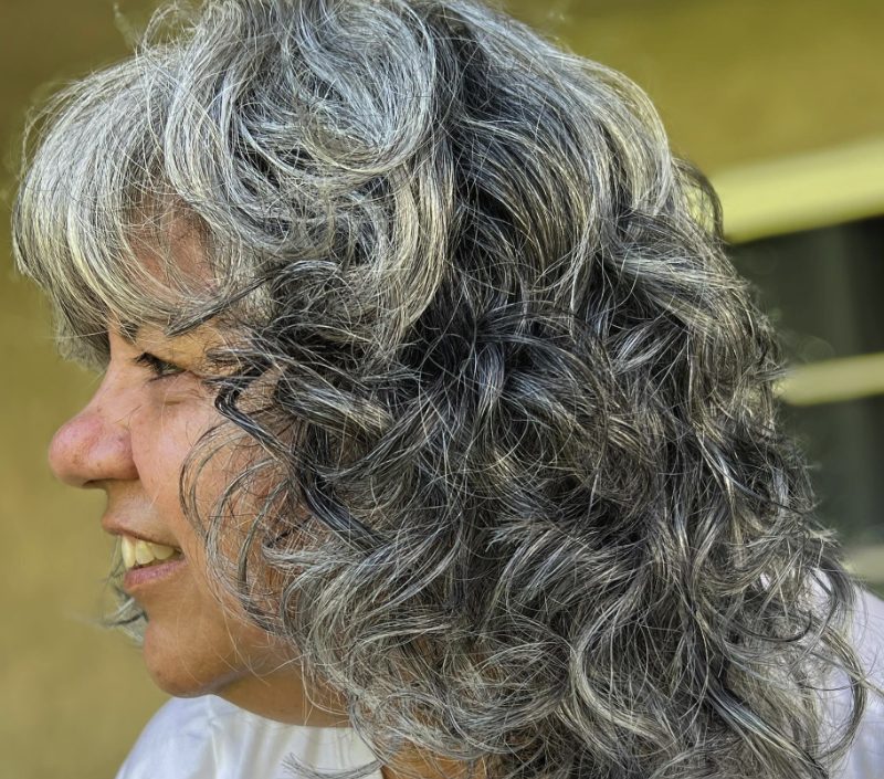 Voluminous Curls with Wispy Fringe