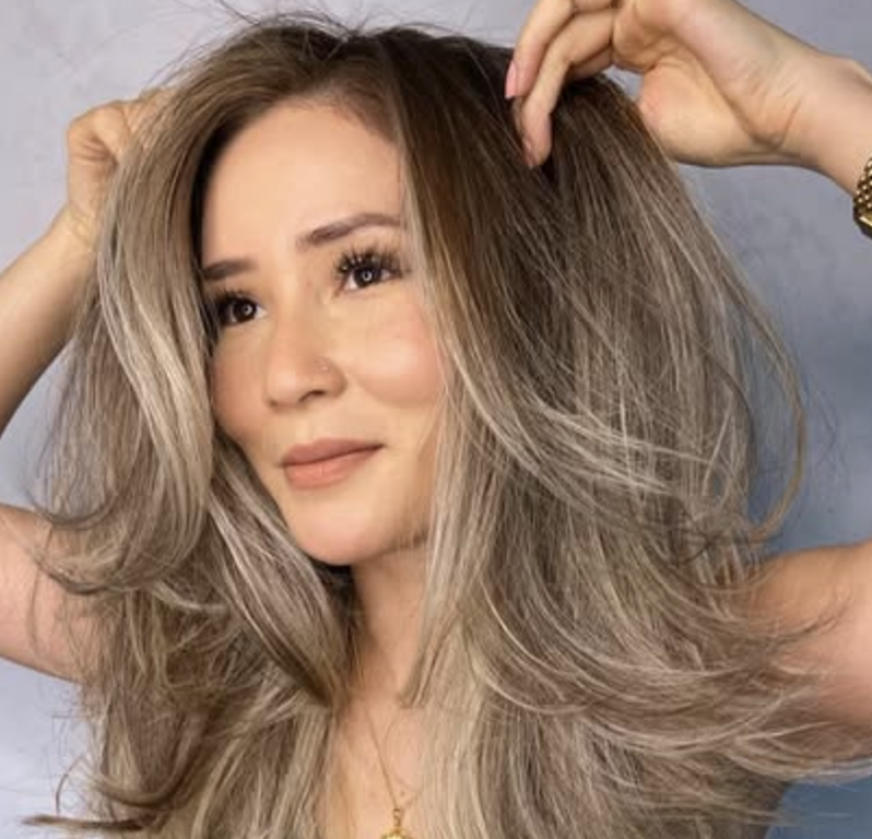 Voluminous Feathered Cut with a Center Part